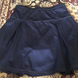 Girls skirt/shorts uniform.